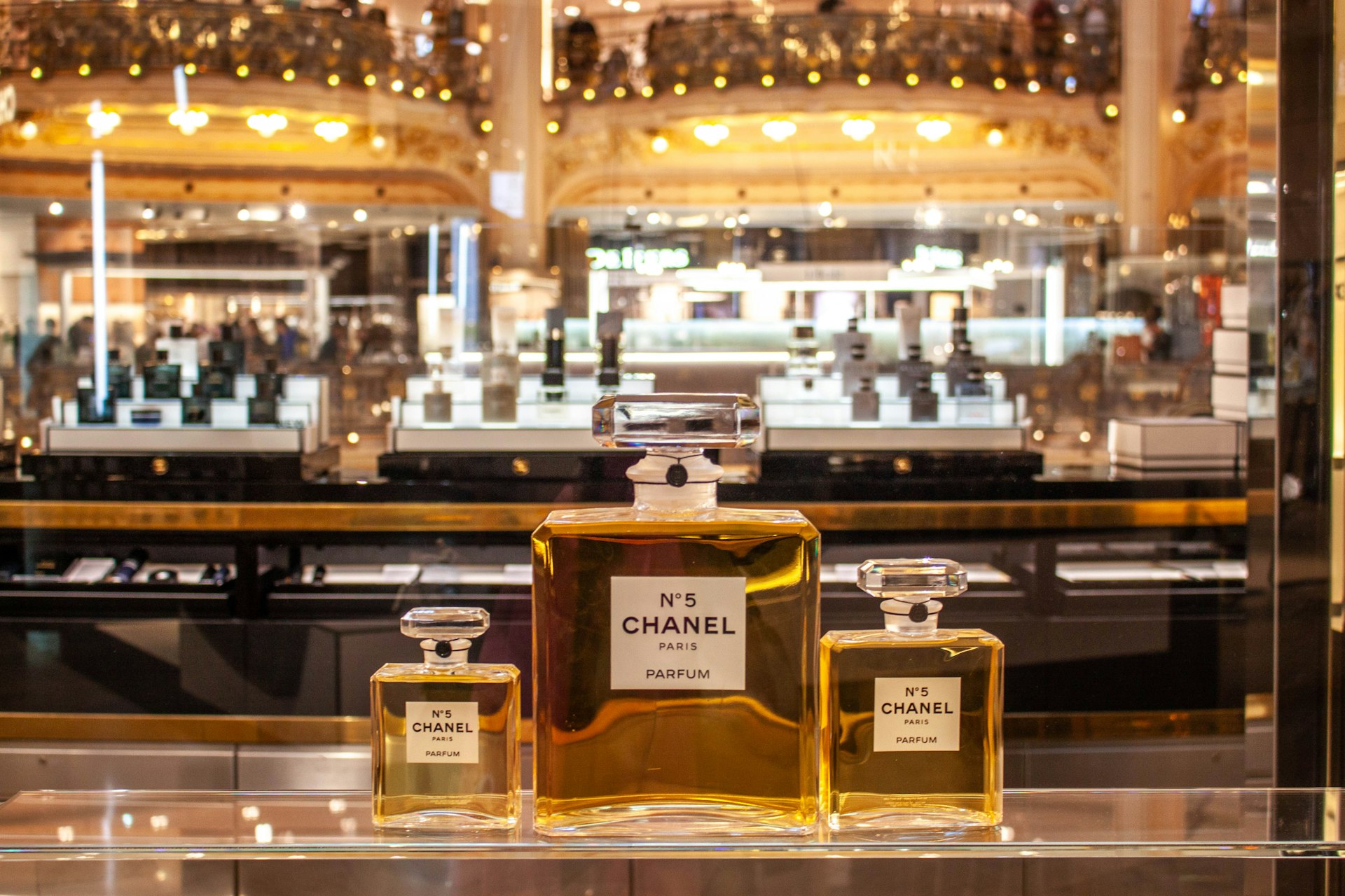 Chanel no. 5 perfume bottles displayed in a store.